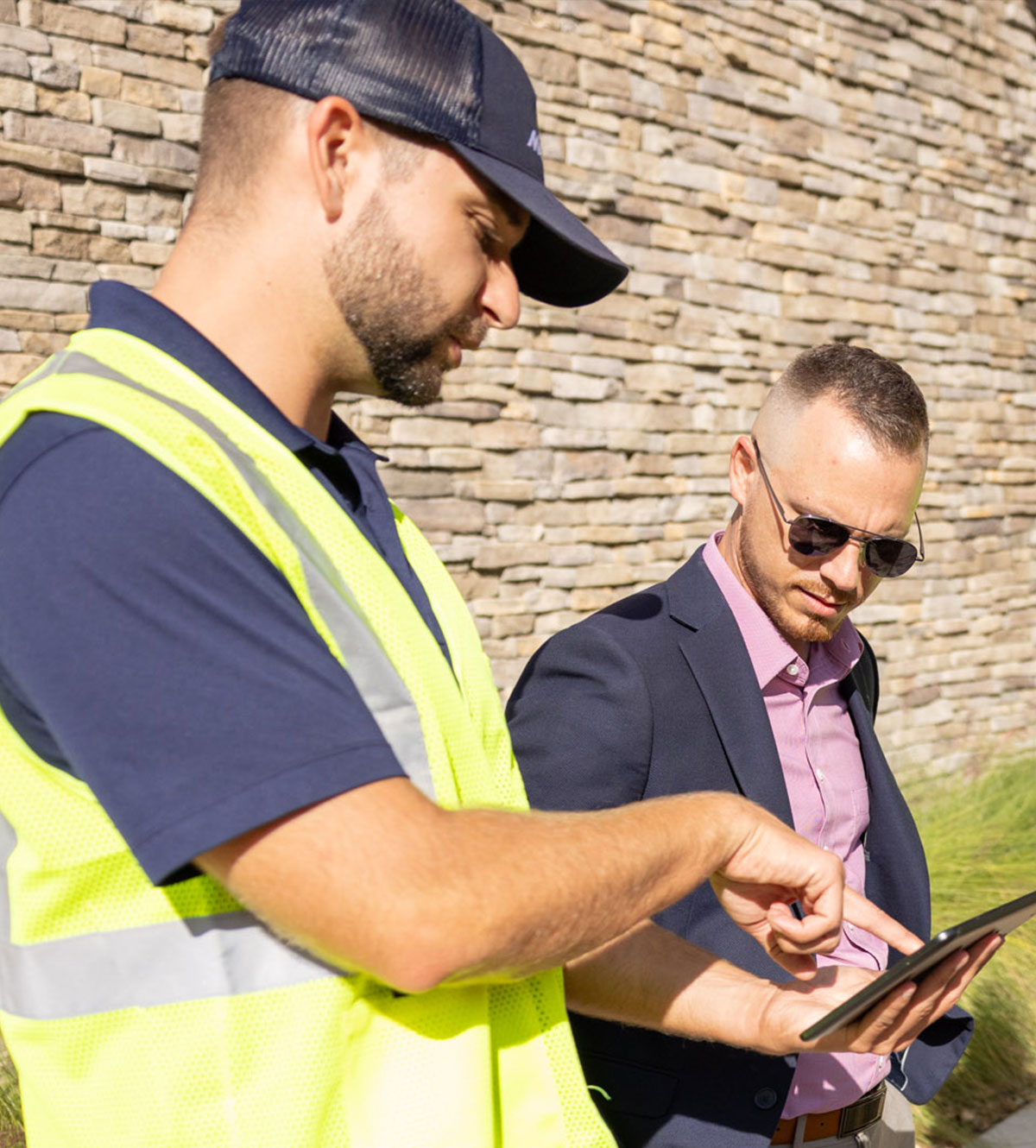 Landscape service crew explaining services to a client